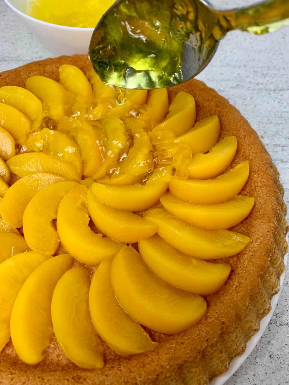 adding jelly to tart